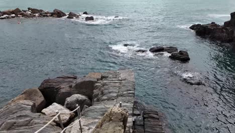 rugged coastline near riomaggiore, italy, showcasing the dramatic cliffs and natural beauty of this breathtaking coastal area