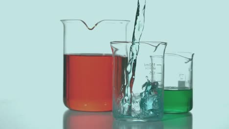 Animation-of-red-spots-over-beakers-with-liquid
