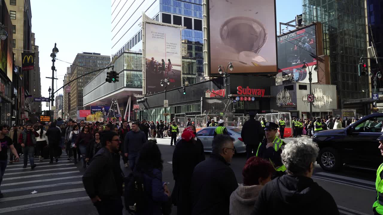 Crowds gather in New York, their energy palpable as they show their support for Trump under the bright afternoon sun