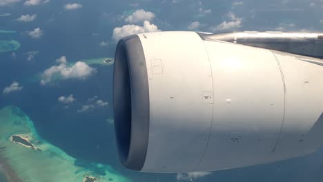 aerial top down view of archipelago of maldives from airplane