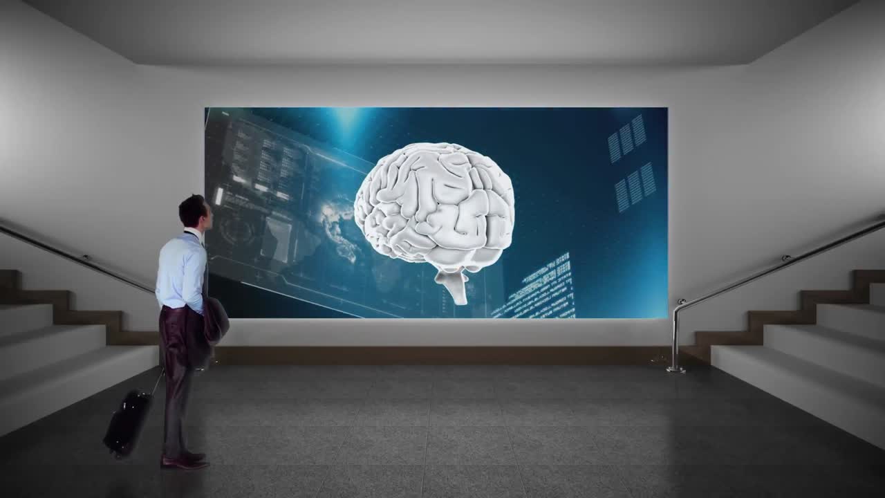 Businessman staring at a screen in a hallway