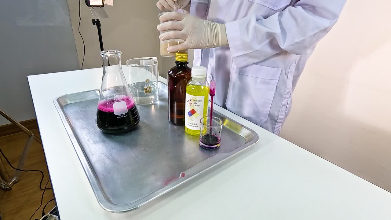 Scientist conducts a vibrant chemical experiment using beakers and colorful liquids under bright lighting in a lab