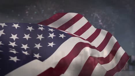 american flag blowing against fireworks