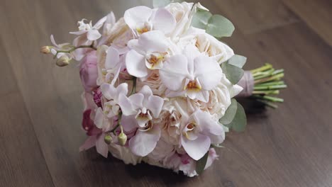 Beautiful-wedding-bouquet-on-wooden-floor