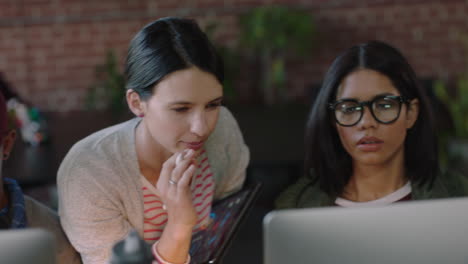 diverse group of engineers developing software app using computer caucasian project manager woman pointing at screen showing professional team ideas delegating work in startup office