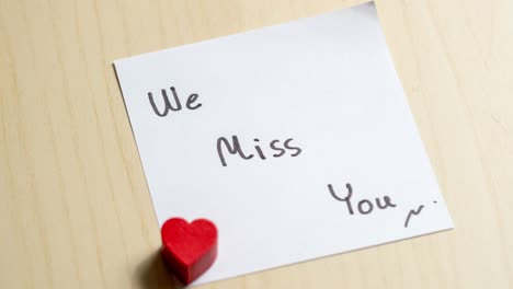 a heartfelt note expressing love and absence captured in a cozy environment.