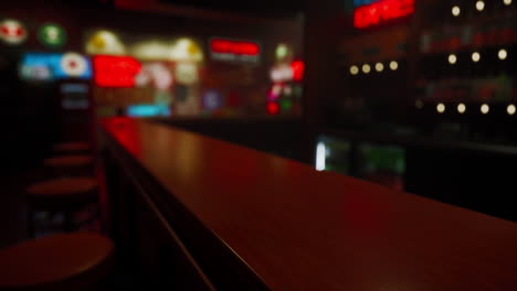 blurred view of a bar counter at night