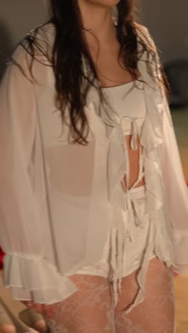 woman in a sheer white blouse