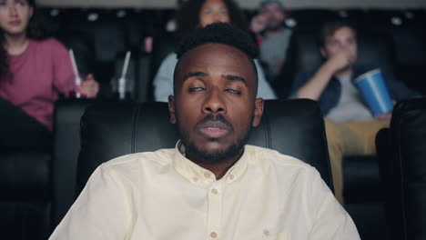 man watching movie at cinema