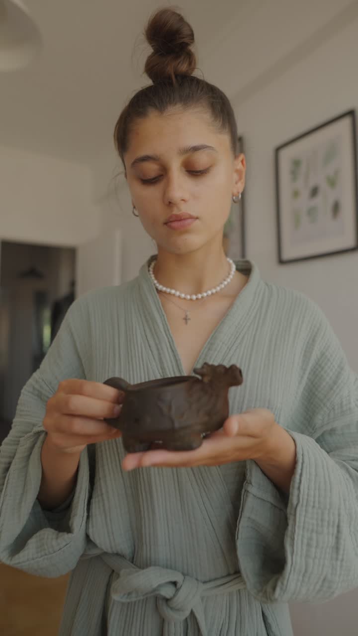 Woman enjoying tea at home