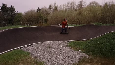 Eboarding-footage-around-a-BMX-pump-track