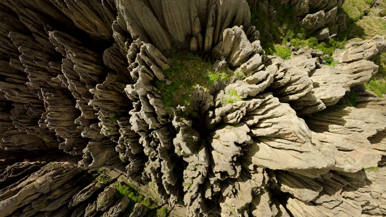 Rock formations in Valle de las Animas, Valley of the Souls, unique geological spires and abstract patterns near La Paz, Bolivia. Aerial top-down descending