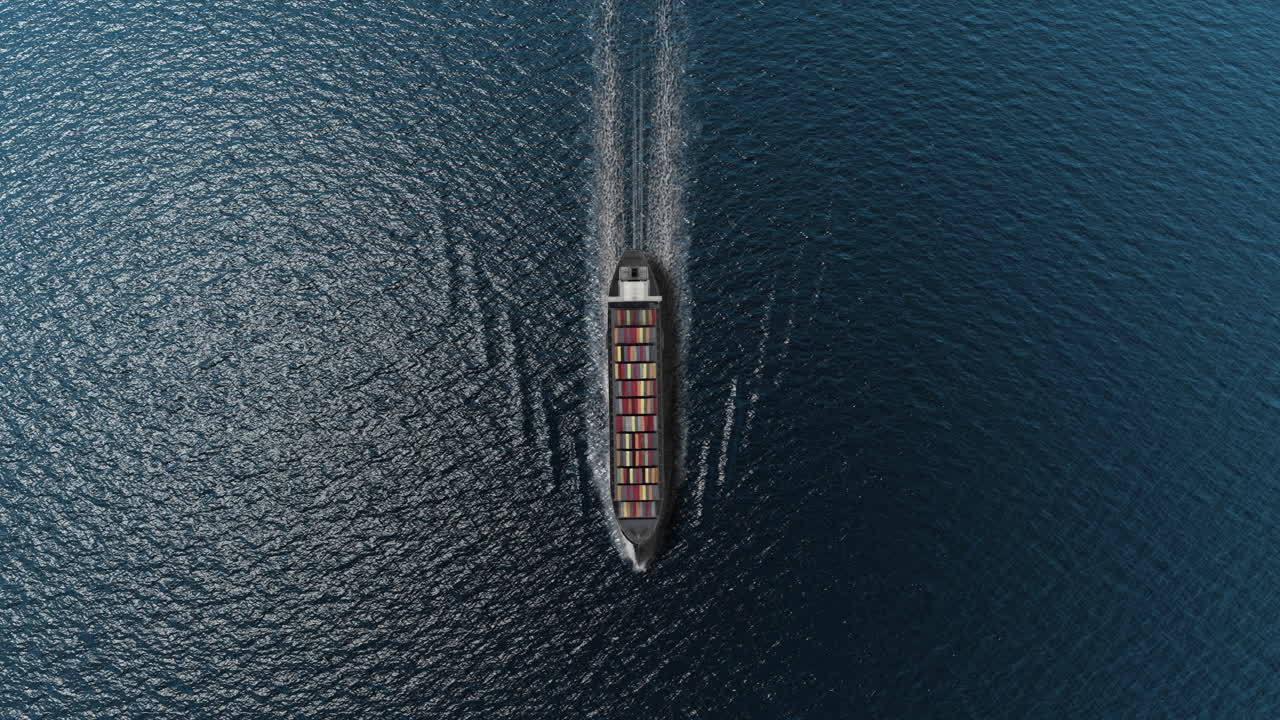 Aerial view of a cargo ship sailing on the open ocean
