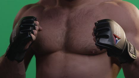 man in mma gloves on green screen