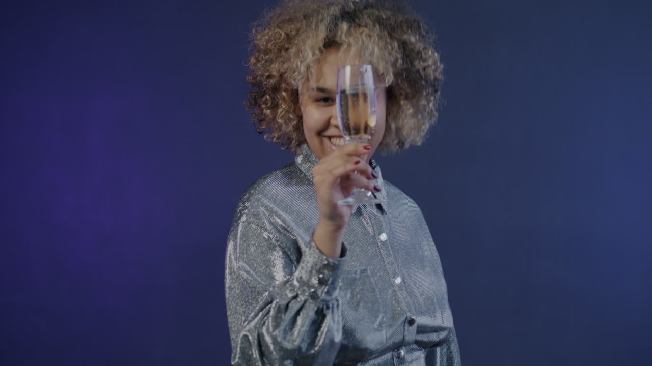 Happy Woman Celebrating with Champagne