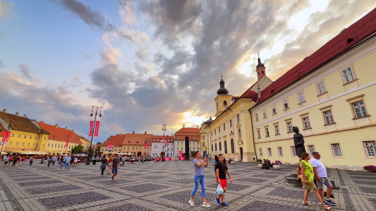 Sibiu, Romania, 17 July 2025: Council Tower of Sibiu at sunset. The Council Tower of Sibiu, Romania, rises above red rooftops at sunset, with blue sky and clouds