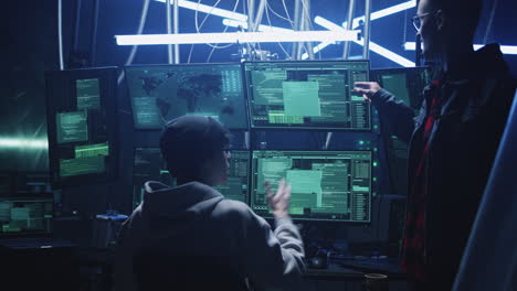 cybersecurity professionals working in a high-tech control room with multiple monitors