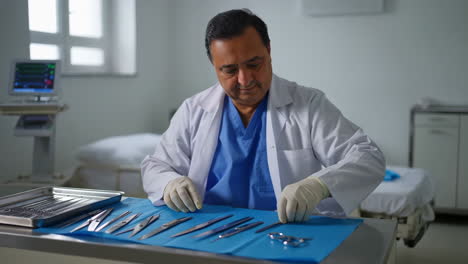 doctor preparing surgical instruments in a hospital room