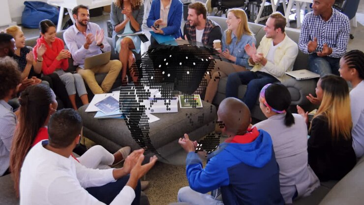 Animation of globe rotating over diverse creative colleagues clapping at casual office meeting