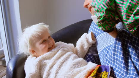 father playing with his children in living room 4k