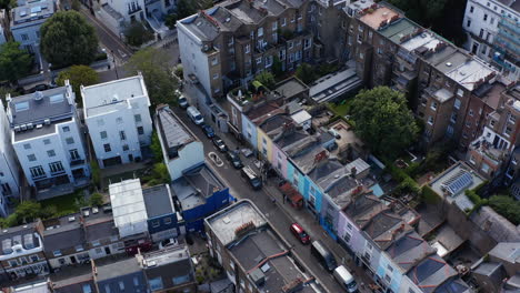 Aerial-view-of-row-of-houses-with-various-color-facade.-Streets-of-urban-neighbourhood.-London,-UK