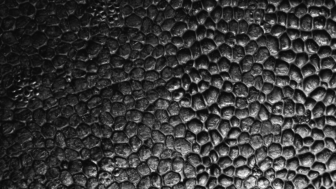 Fundo abstrato com padrão de superfície texturizada escura