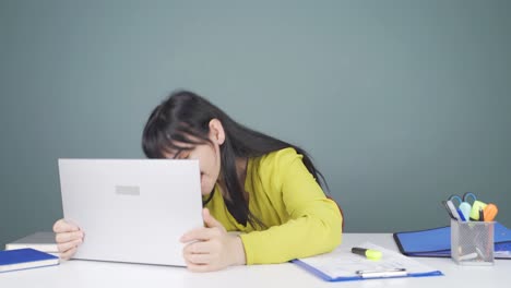 woman joyfully embracing laptop.