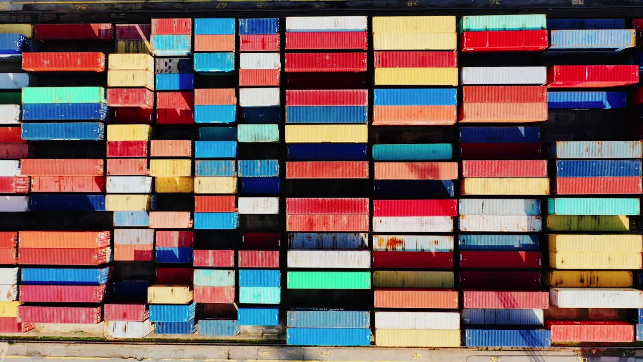 Vibrant container pattern captured in top down shot as camera glides sideways