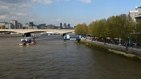 view of the festival pier from the golden julbilee bridge, london, united kingdom