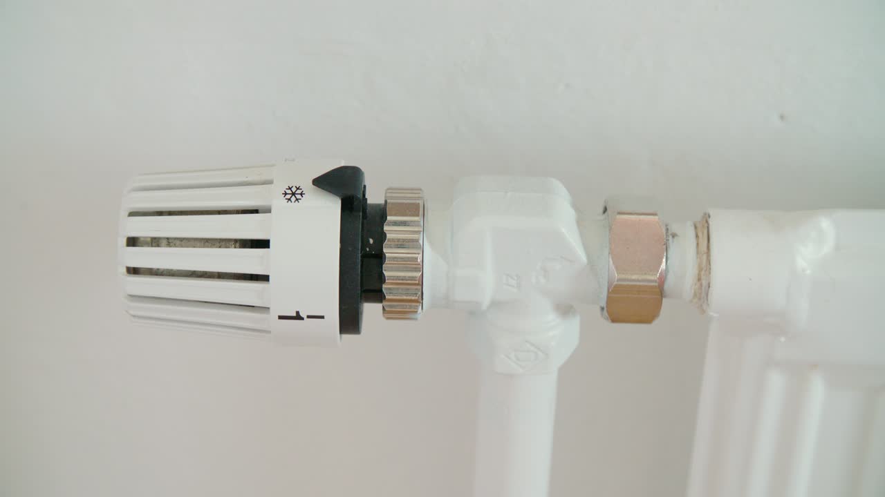 Radiator know turning up heating, close up