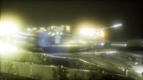 tanque en la oscuridad con luces brillantes