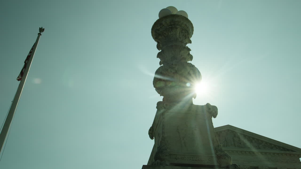 Supreme Court lens flare backlit panning shot.
