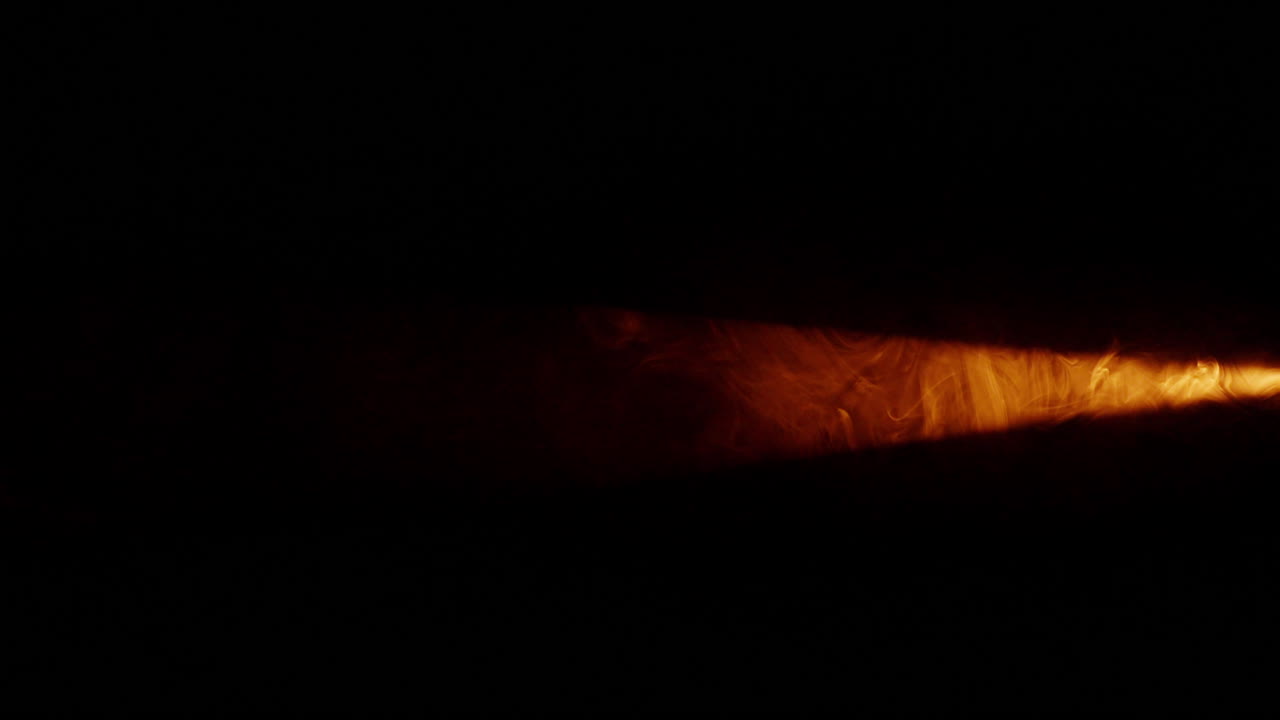 Abstract orange steam swirls against dark backdrop for VFX overlay