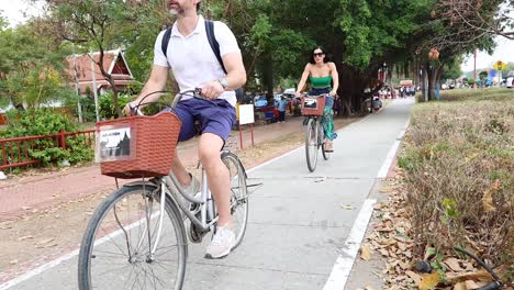 cyclists enjoying a ride on a park pathway