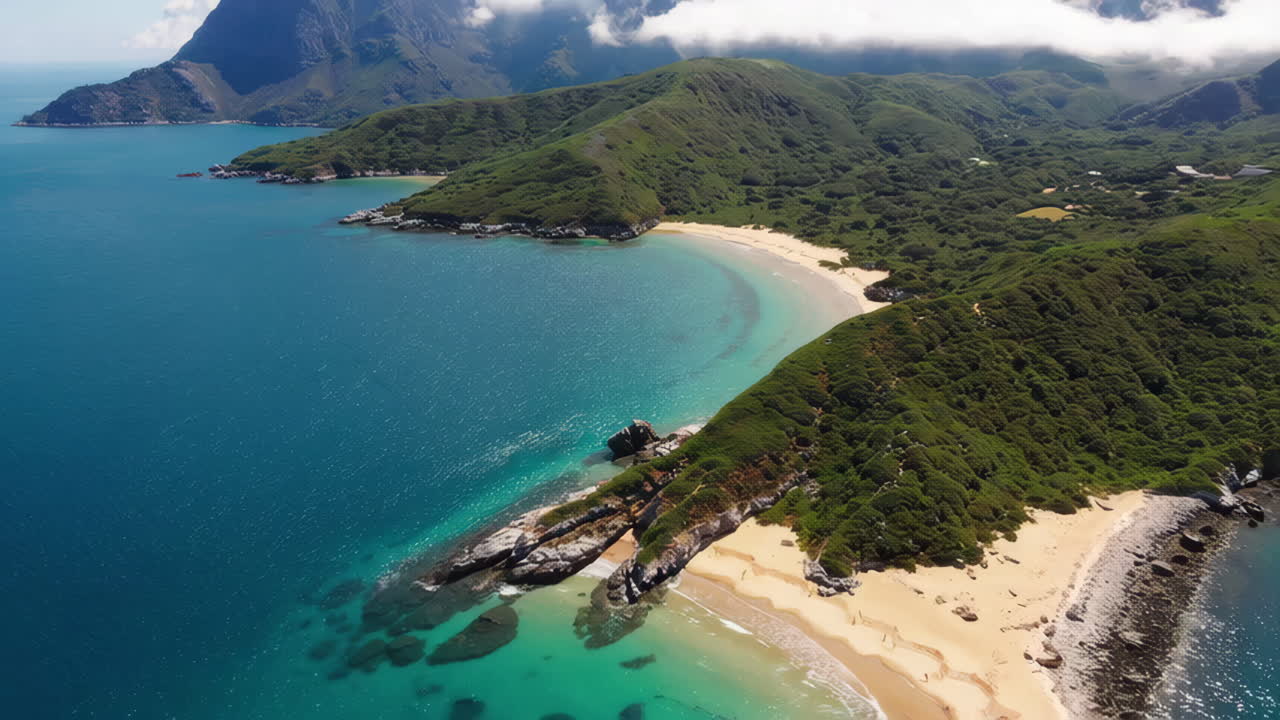 Aerial View of a Secluded Beach with a Sailboat