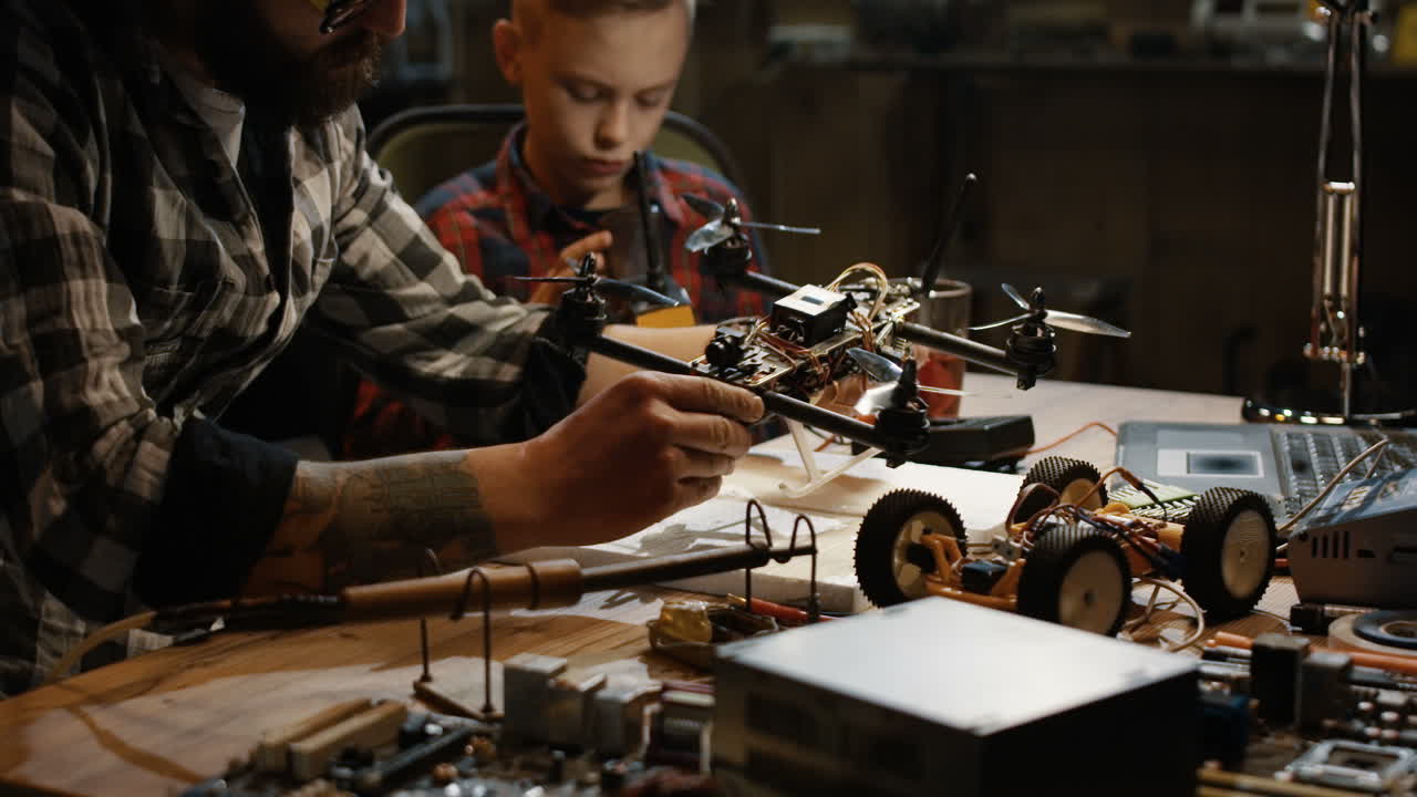 Father and Son Building a Drone and Robot