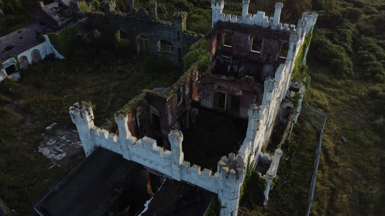 Soldiers point house aerial view rising across abandoned Holyhead Victorian mansion rampart rooftop
