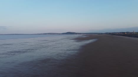 Cinematic-Aerial-of-Aberavon-Beach-at-Sunrise-in-Port-Talbot