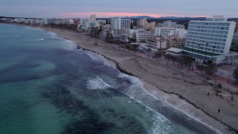 Cala-Millor-Mallorca,-Hotel-lined-beachfront,-Aerial-view-cloudy-evening