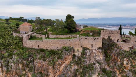 side aerial view of the historic fortress of akronafplia in the peloponnese region, greece