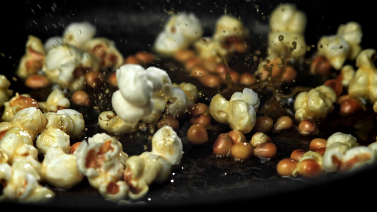 Popcorn Kernels Popping in Slow Motion in a Hot Pan