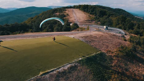 paraglider spreading his gliding wing but failing to take off from the paragliding start