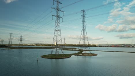 smooth low angle view of high voltage electricity pylons also known as transmission towers near southampton in the uk