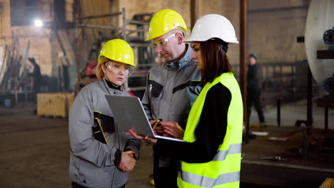 two co-workers talking at work