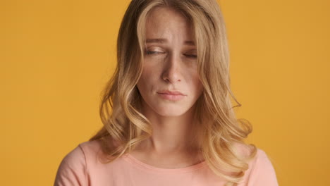 Caucasian-woman-looking-sad-on-camera.