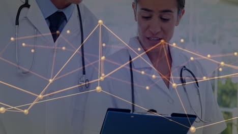 Discussing patient data, doctors with network connections animation overlay in hospital