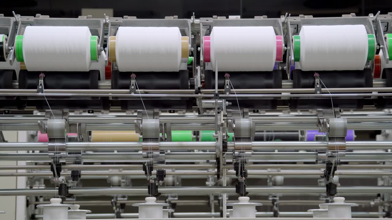 Texture manufacturing factory yarn processing large spools of yarn winding texturizing