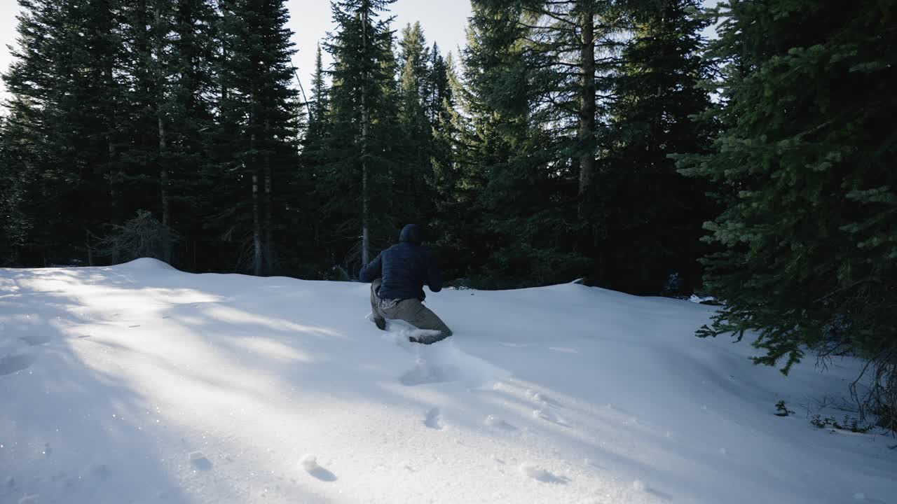 Slow Motion 120p Man diving into the snow in the mountains.