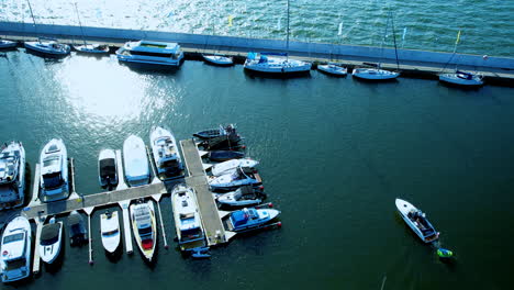 Aerial-shot-of-diverse-boats-docked-in-water