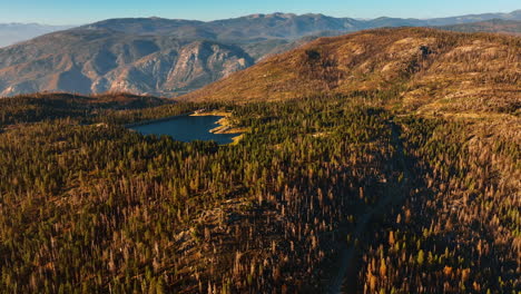breath-taking view of a sunlit mountainous landscape with lake in the middle. top view of the sierra national forest in usa.